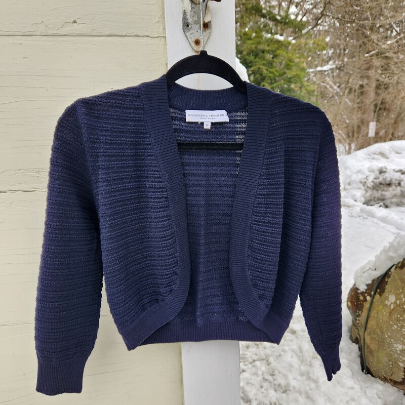 Carolina Herrera New York Navy Cardigan Size M<br />
Merino Wool made in Italy<br />
Pit to Pit 17 inches across<br />
Pit down sleeve 13.5 inches<br />
Down the back 17 inches<br />
EUC<br />
Retail $600