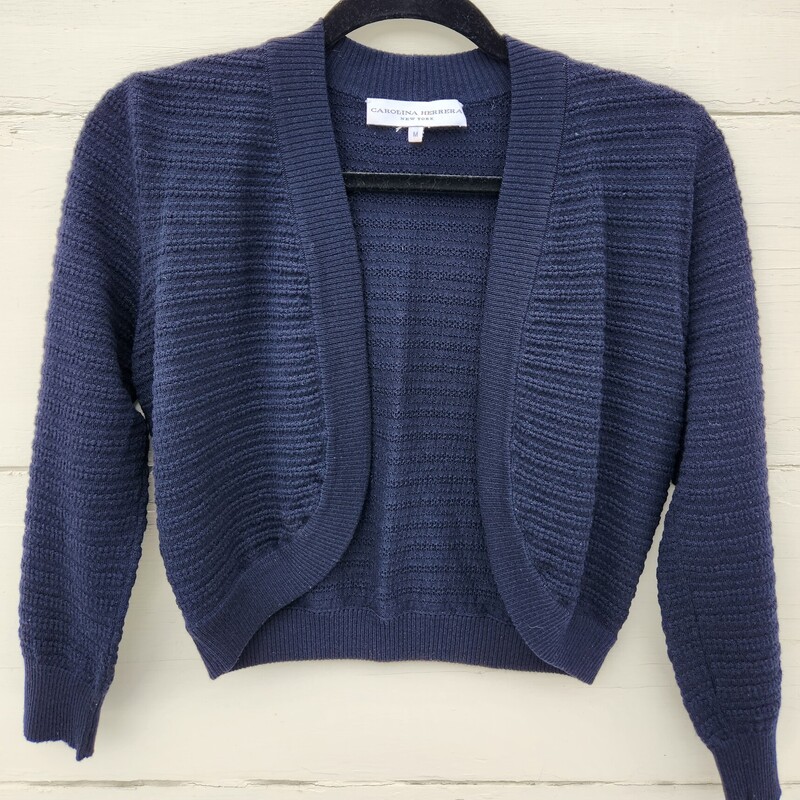 Carolina Herrera New York Navy Cardigan Size M<br />
Merino Wool made in Italy<br />
Pit to Pit 17 inches across<br />
Pit down sleeve 13.5 inches<br />
Down the back 17 inches<br />
EUC<br />
Retail $600