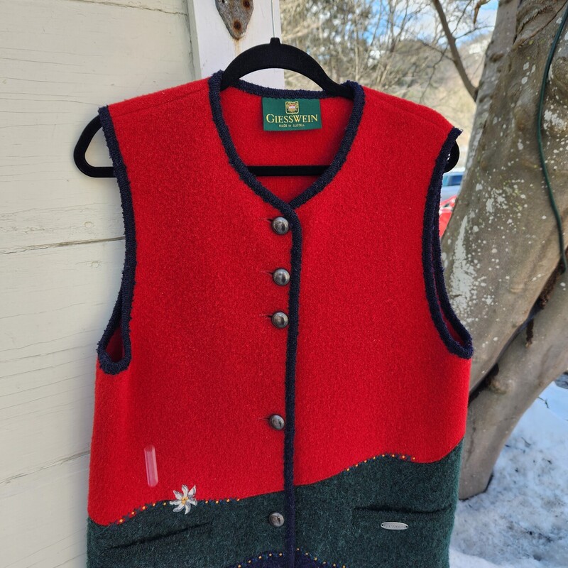 Vintage Giesswein Wool Vest  size L/XL<br />
Red, green and Navy Wool with embroidered flower<br />
Pit to Pit 20.5 inches across<br />
Sleeve opening 10.5 inches<br />
Waist 20.5 inches across<br />
Hip 21 inches across<br />
Down the back 26 inches<br />
EUC