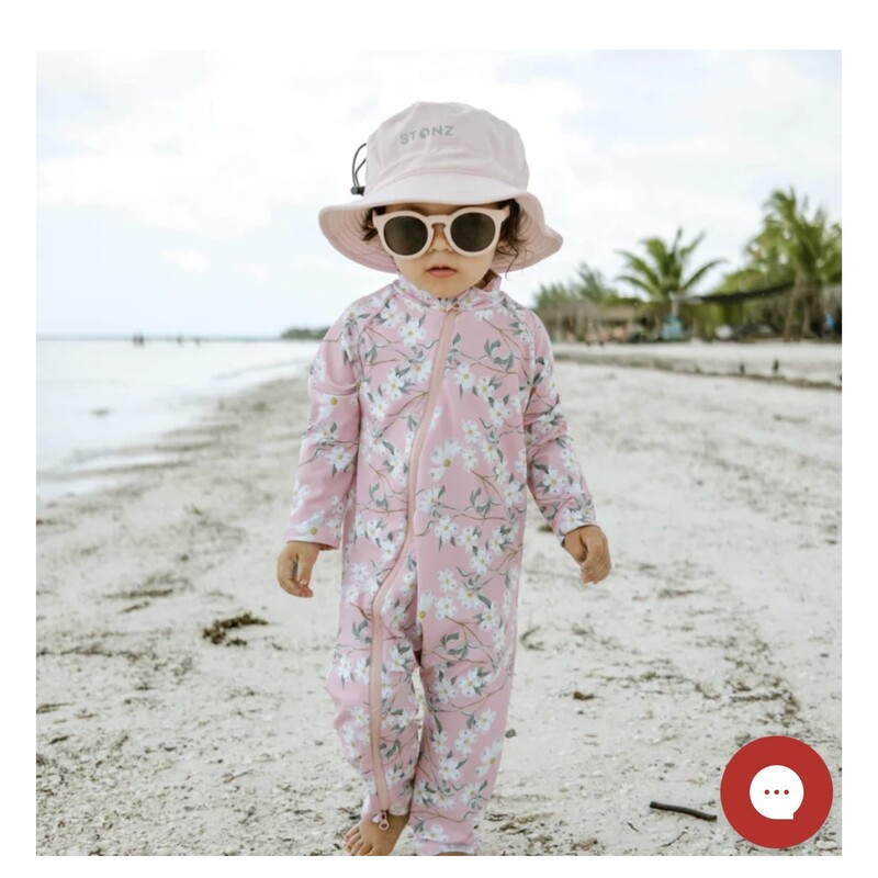 Stonz Sun Suit, Pacific Blossom, Size: 18-24M

This summer, skip the sunscreen hassle and keep your baby safe with our delightful sun suits. Crafted from non-toxic, tightly woven UPF 50+ fabric, this versatile bathing suit will quickly become a wardrobe essential. Thanks to the full-length zipper, diaper changes and potty breaks are a breeze!

Offering full-body coverage, including the neck, in seconds, simply zip up their swimsuit and they're ready for fun in the sun. Perfect for any outing, whether it's the pool, beach, waterpark, or a picnic, our prints and colors stay vibrant wash after wash.

Chemical-free UV protection that lasts: The tight-knit fabric is what keeps this sun suit effective. That means that no matter how many times you wash it, it’ll protect your little one from the harsh sun without exposing them to harmful substances.Easy bathroom breaks: Convenience is key with our two-way, full-length zipper, making bathroom breaks stress-free without the hassle of buttons.Good for swim and play: Transition seamlessly from playtime in the park to a dip in the pool with our lightweight, quick-drying fabric, eliminating the need for extra outfits.Designed for movement: our sun suits feature soft, stretchy fabric and breathable sides, allowing your child to play comfortably all day long without overheating. Plus, they're machine washable for easy upkeep, giving you one less thing to worry about this summer.